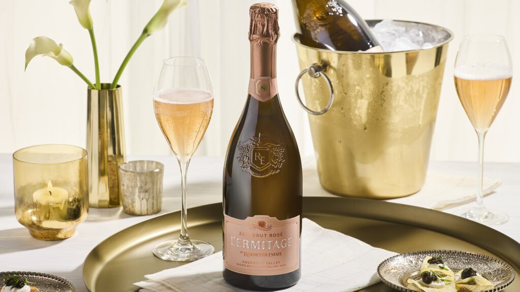 2019 L'Ermitage Brut Rosé displayed on a table.